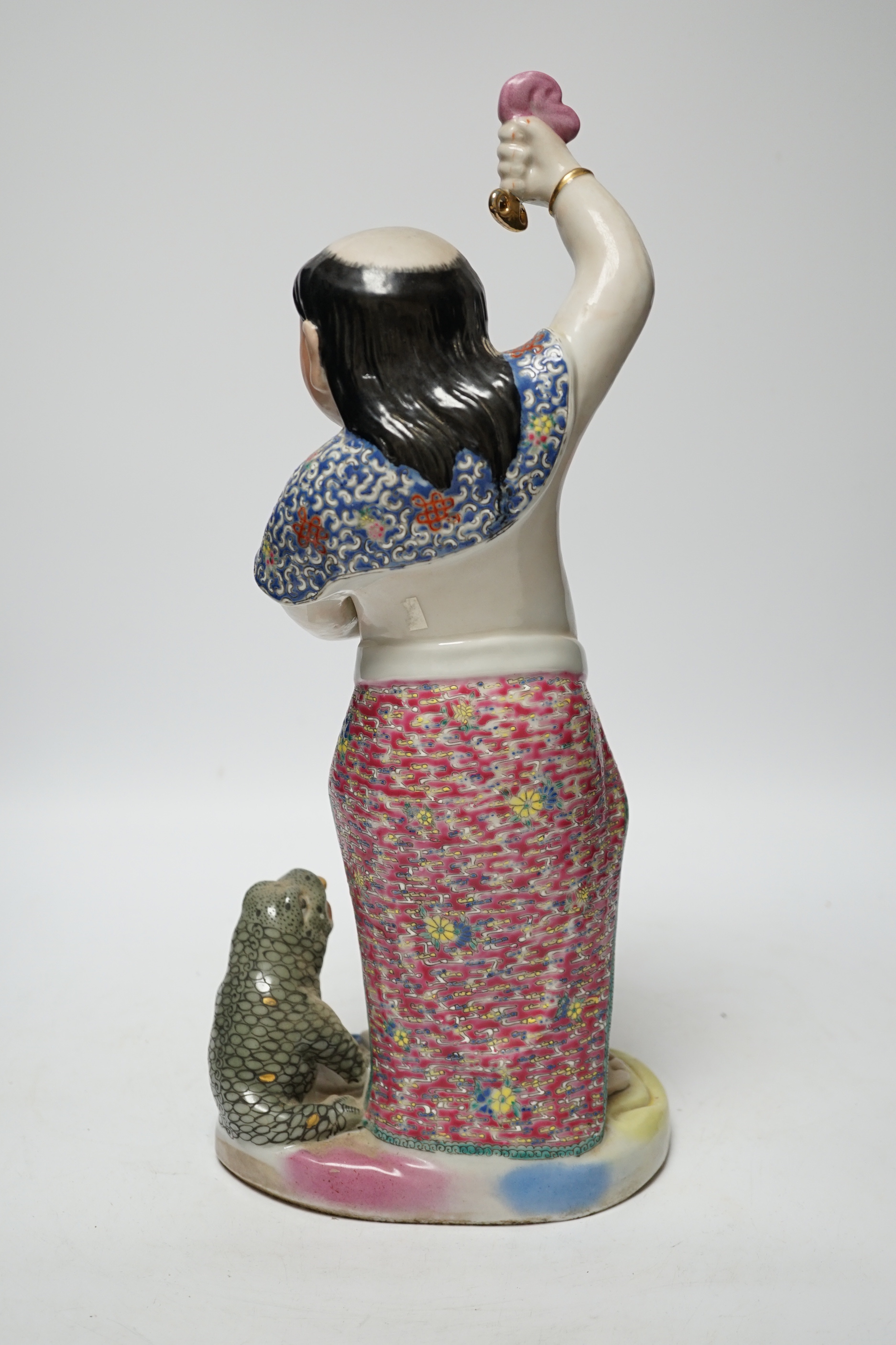 A Chinese famille rose porcelain figure of Liu Hai, stamp to base, 39cm